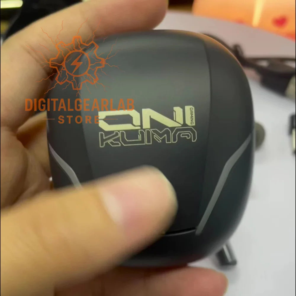 Black and gray fishing reel with ’oni kuma’ branding.